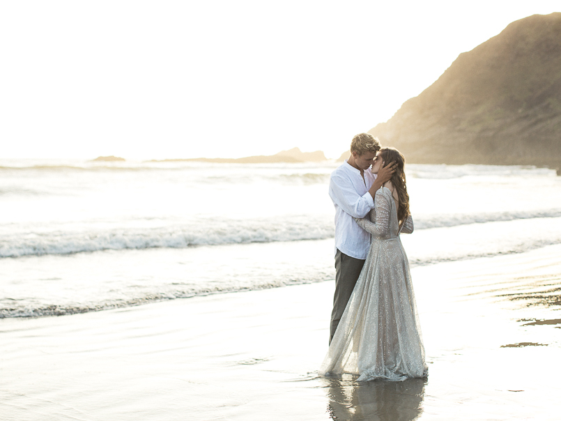 passionate bride and groom photo on the beach at sunset