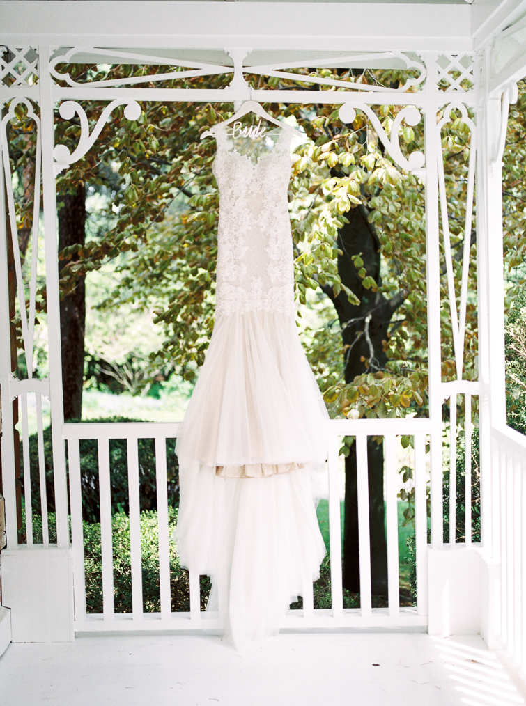 photo of bride's dress hanging outside kurtz orchards bridal suite