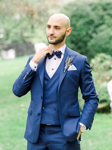 portrait of groom in blue suit at kurtz orchards