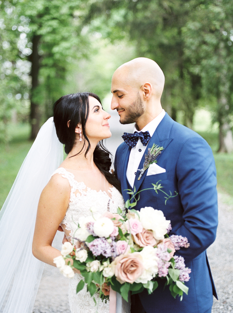 portrait of bride and groom at their kurtz orchards wedding in niagara on the lake