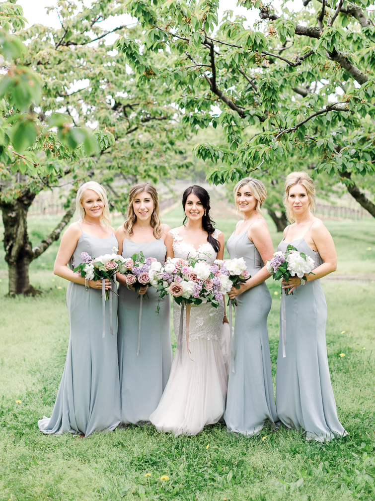 photo of bride with her bridesmaids at kurtz orchards