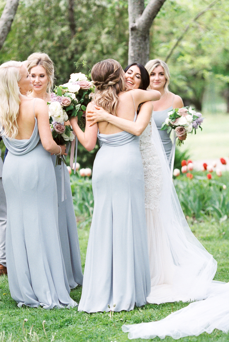 bride and bridesmaid in pale blue