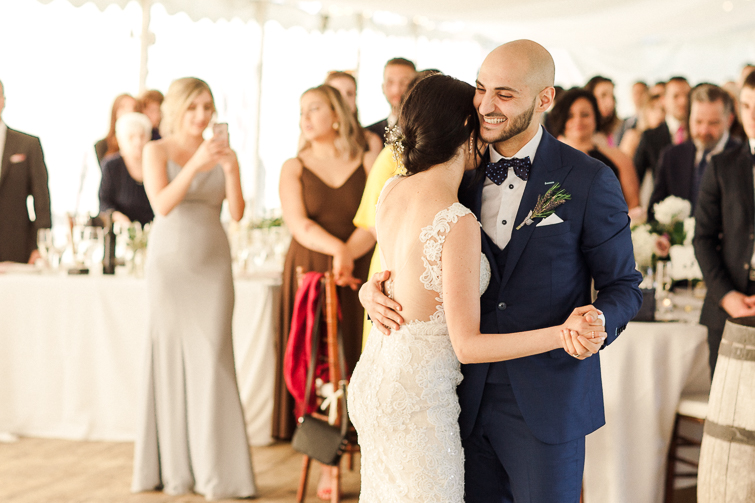 groom laughing at their first dance at kurtz orchards tent reception