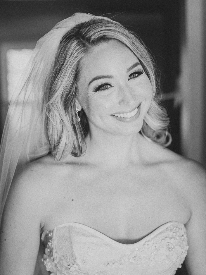 black and white portrait of bride smiling
