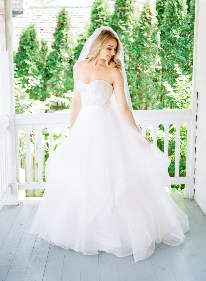portrait of bride on the porch at her doctor's house suite