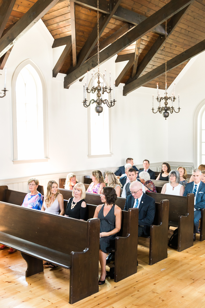 guests sitting inside the chapel at a doctor's house wedding